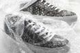 two gray sneakers with bubble wrap pattern on canvas surrounded by bubble wrap