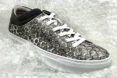 gray and white vegan shoe with bubble wrap print on canvas surrounded by bubble wrap