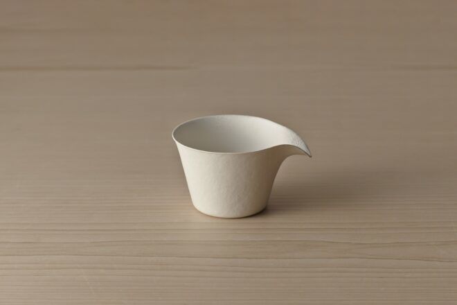 A disposable pouring cup.