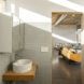 A bathroom with a white sink and white walls.