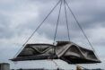 3D-printed bridge piece being airlifted into place