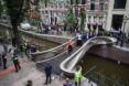 parade of people on 3d-printed smart bridge in Amsterdam