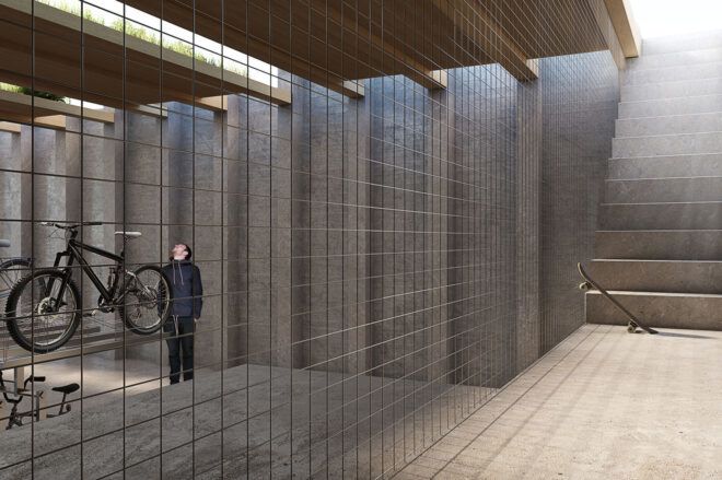 A staircase leads down into a bike parking area where a person stands inside.