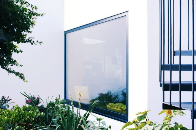 A large square window on the side of the home.