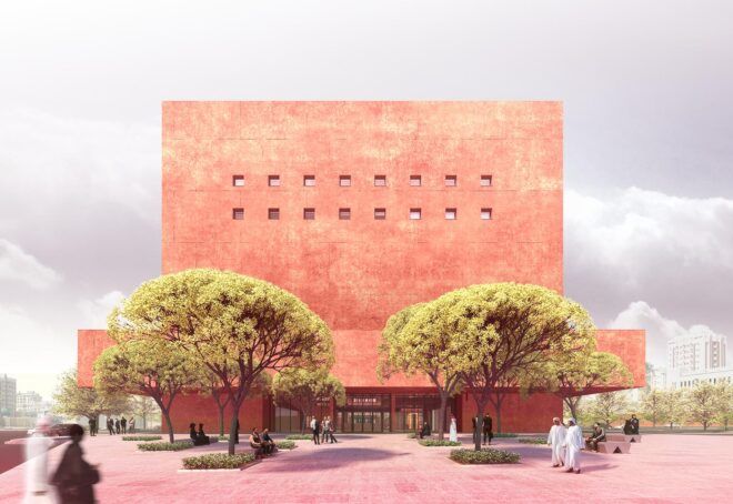 A tall, orange building with two trees on either side.