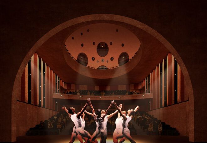 A theater with a group of people posed on stage.