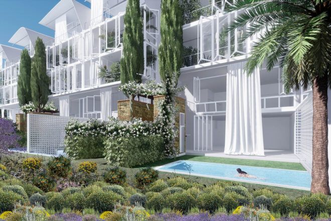 A ground view of the pool in front of the buildings.