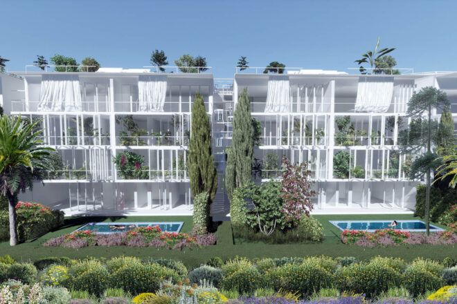 Two white box-like structures surrounded by plants, with a pool in front of each structure.