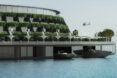 The side of a floating hotel, showing green balconies on the side of the building.
