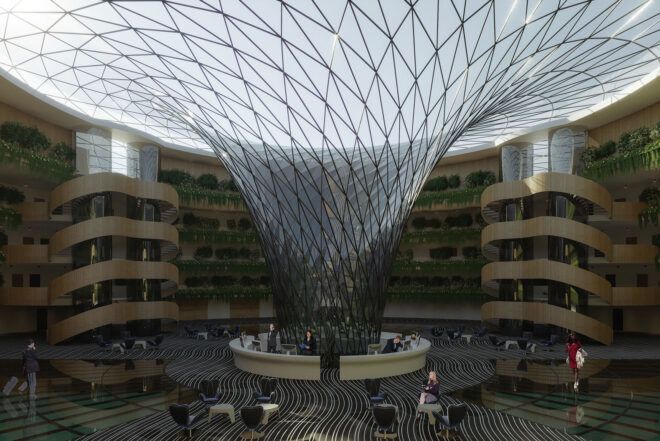 The inside of the hotel, showing a circular lobby with a glass structure emerging from the center and going up to form the hotel ceiling.