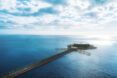 An overhead view of the hotel, showing a long pier leading up to a circular structure.
