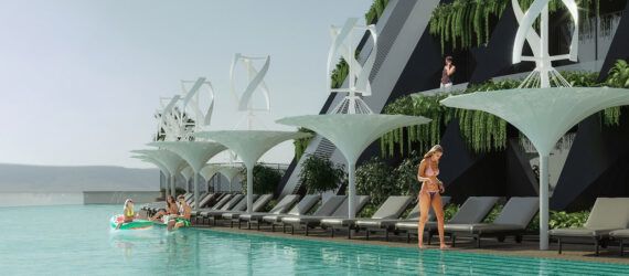 A pool area lined with white fixtures topped with helixes. In the background, people stand on their balconies on the hotel building.