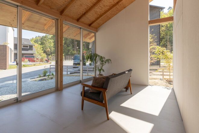 gray couch facing wall of glass