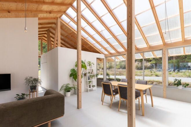 minimalist living area with glass and wood ceiling