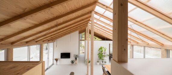 aerial view of white living area with unfinished wood touches