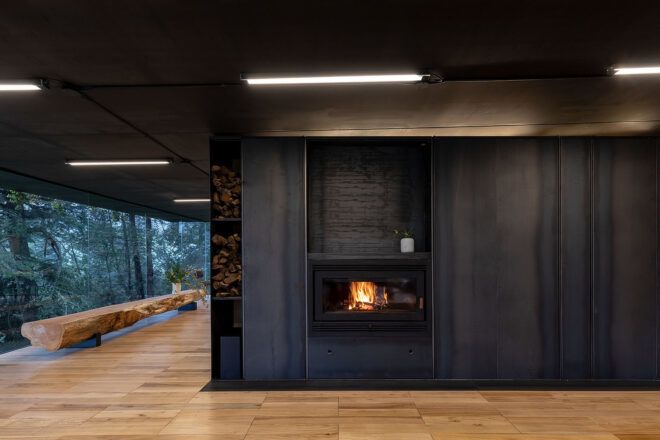 A fireplace built into a dark wall.