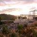 steel house frame on an island at sunset