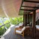 wood chairs on wood patio covered by extended roof