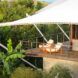 two white and wood chairs on a patio