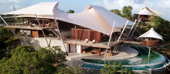 wood home with tensile roofs