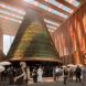 rendering of cone-shaped vertical farm inside a pavilion with colorful solar roof