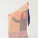 person holding thin, transparent solar panel with graphic design pattern
