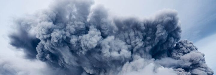 A large cloud of smoke in the sky.