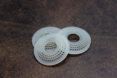 Three white translucent disks stacked on each other.