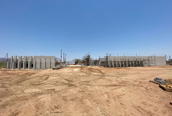 A construction site in the middle of a desert.
