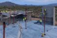 People working on the foundation of a construction site.