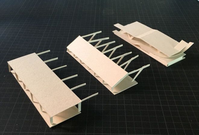 A diorama in three parts showing how the structure will be assembled.