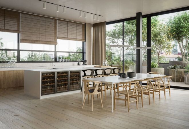 A kitchen with white counters, wood floors and a table with chairs.