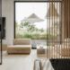 A view of the bedroom through wooden slats.