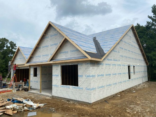 Front and side facades of house under construction