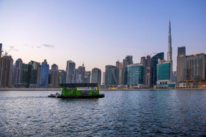 Aqua pod against the Dubai skyline in the evening