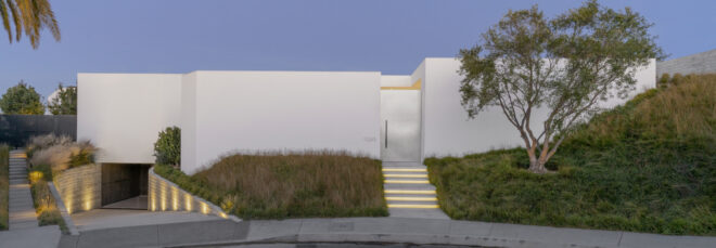 Entry to a single-story white house.