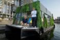 Aqua pod design team posing in front of the pod