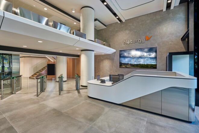 A neutral-toned lobby with a Z-shaped front desk.