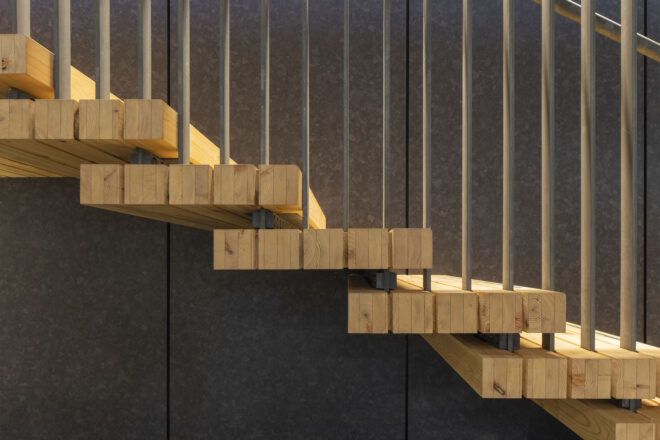 A sideview of a set of wood stairs.