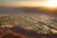 A bird's-eye rendering of a gridded city in a desert.