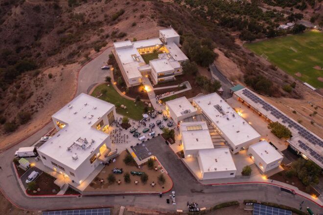 A bird's-eye view of a large campus in a desert area.