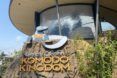 The exterior of a zoo building with a sign reading 