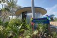 The exterior of a zoo building with a blue sign reading 