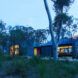 A landscape shot of the home's exterior at dawn.