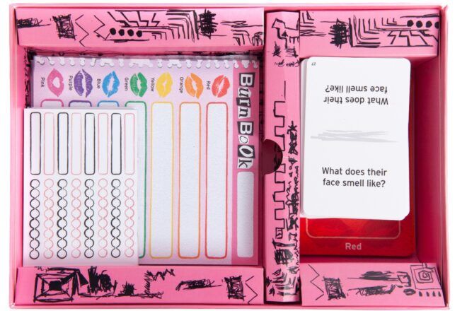 A close-up of the game pieces for Burn Book.