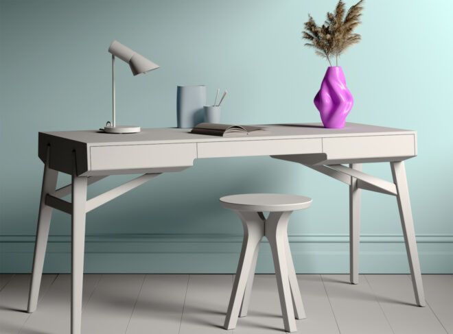 A purple vase of flowers on an off-white writing desk.