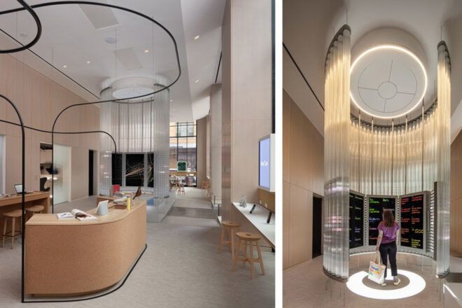 To the left, a beige display counter with a black frame that flows throughout the room. To the right, a person next to a lit-up display space.