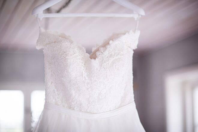 Wedding dress hanging on a hanger