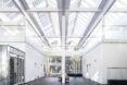 White hallway with a open glass ceiling