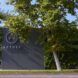 Exterior of headquarter with the name AETHER and logo seen